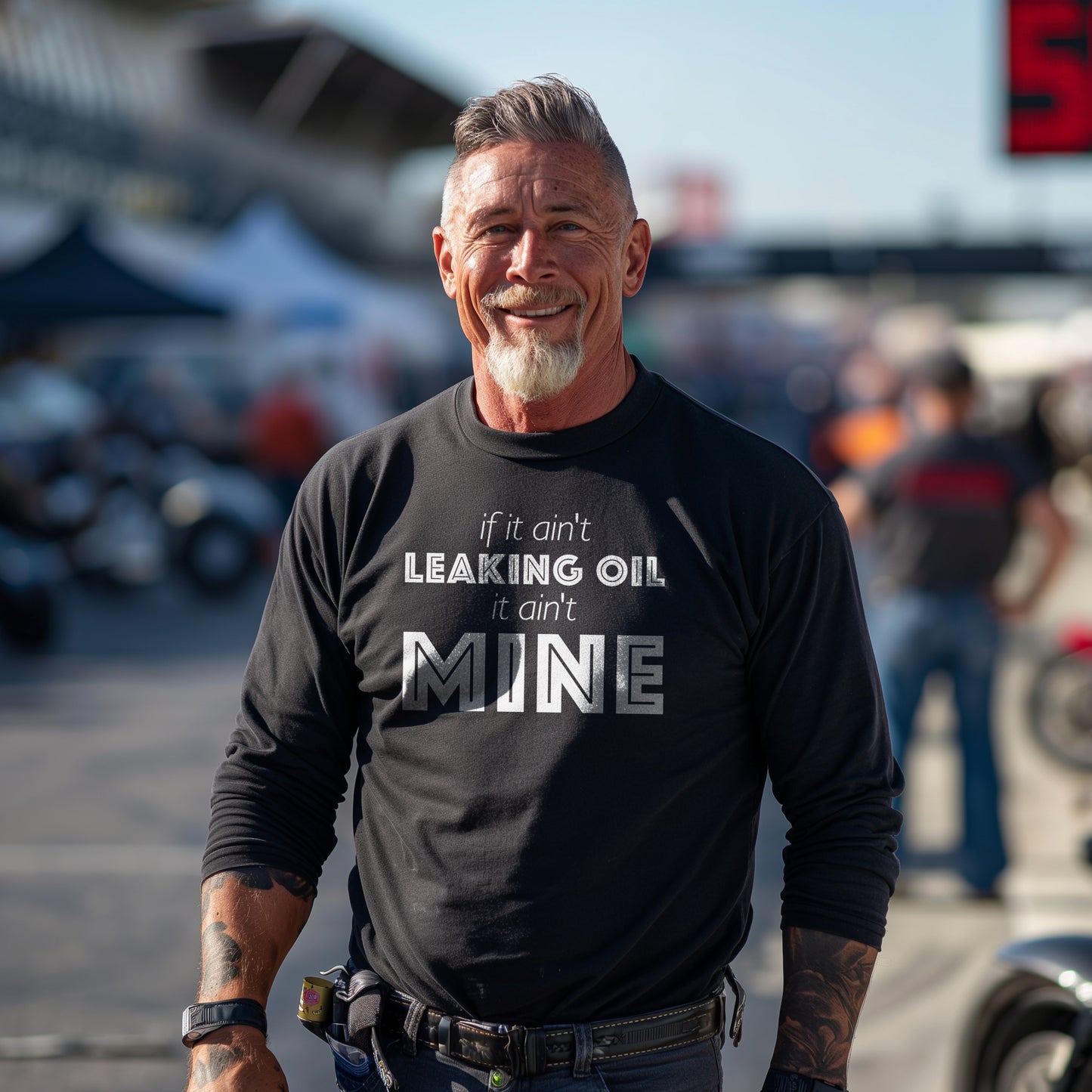 If It Ain't Leaking Oil It Ain't Mine Unisex Long Sleeve Tee